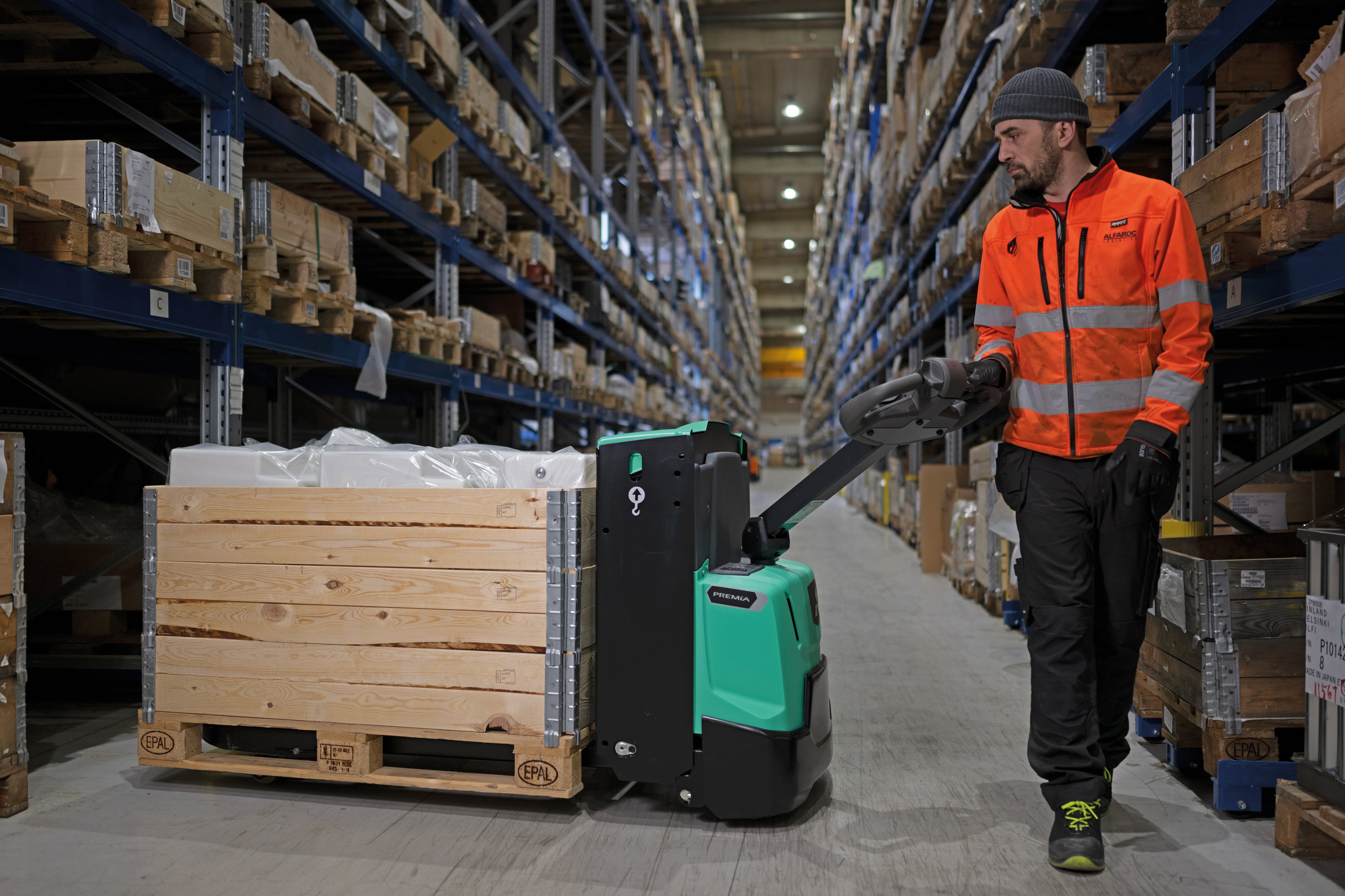 Power pallet truck navigating tight warehouse spaces