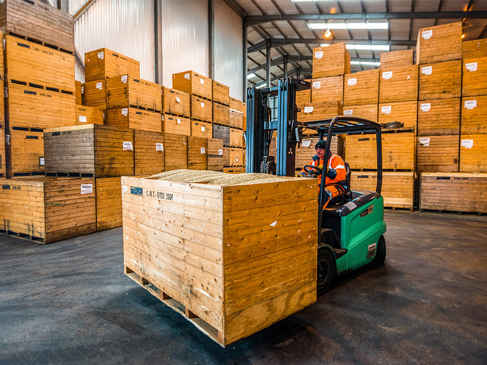 EDIA electric counterbalance forklift operating in CWT warehouse